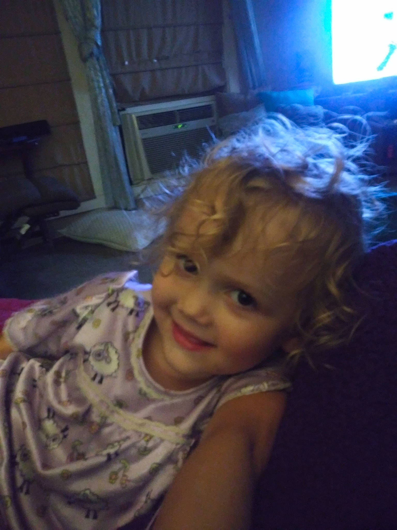 Alaina is registered to the contest to win money with this photo: chair, child, comfort, curtain, darkness, flash_photography, fun, hair, happy, iris, joy, mouth, night, nose, person, picture_frame, purple, room, sitting, smile