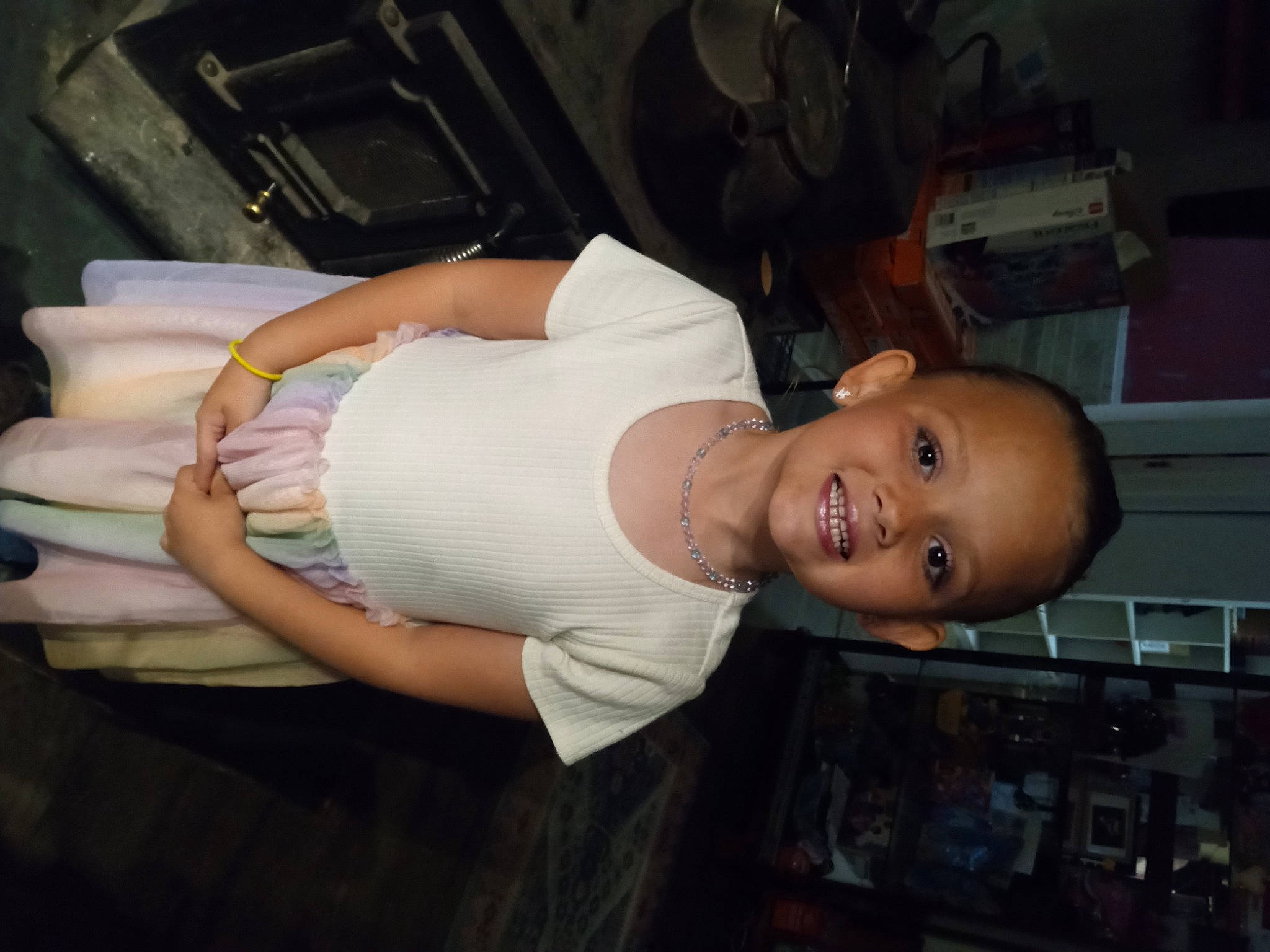 Alaina is registered to the contest to win money with this photo: abdomen, chest, elbow, flash_photography, fun, hat, human_leg, joint, joy, leg, person, room, shorts, sitting, smile, t_shirt, thigh, trunk