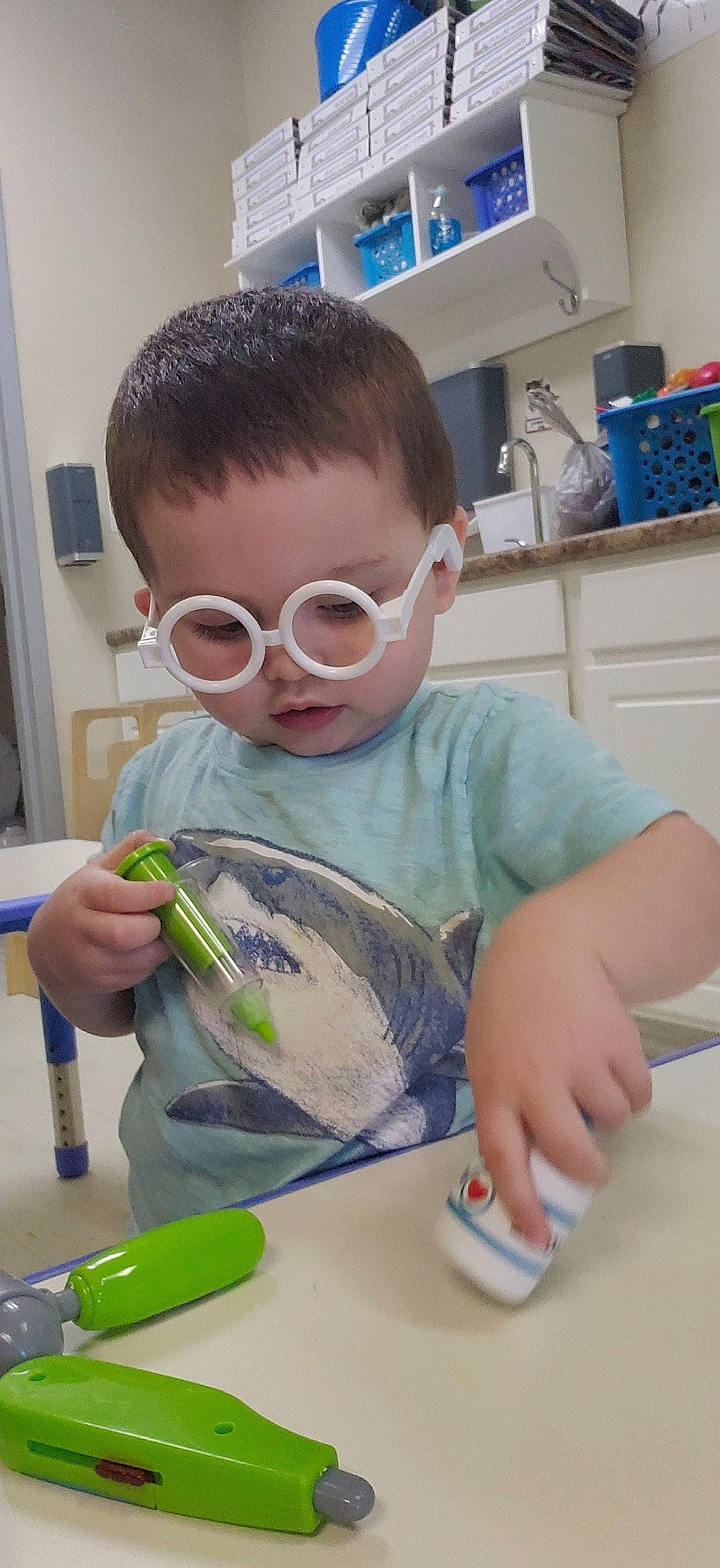 Diego joined the competition — help win amazing prizes! baby, blue, brush, child, drinkware, duct_tape, eyelash, eyewear, glass, glasses, goggles, paint, person, science, sunglasses, t_shirt, table, tableware, toddler, vision_care