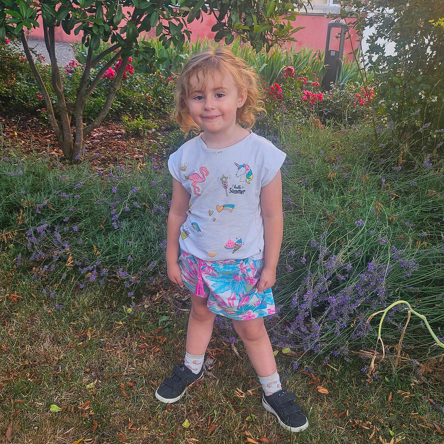 Tessa participe au concours pour gagner de l'argent avec cette photo : child, cute, daylight, flamingo, flowers, garden, grass, greenery, happy, nature, outdoor, person, plants, shirt, shoes, skirt, smiling, socks, tree, unicorn