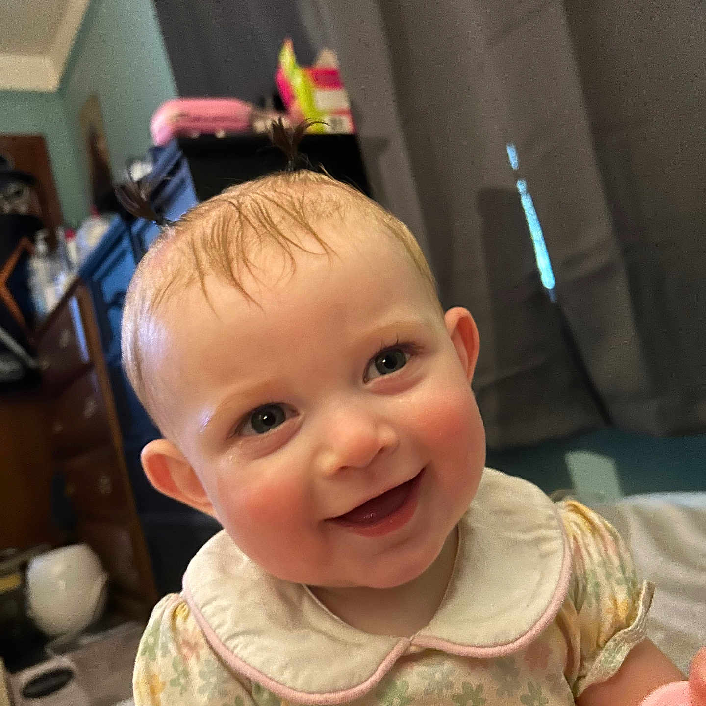 Elowyn Saige joined the competition — help win amazing prizes! baby, child, smile, happy, indoor, person, face, hair, curtain, furniture, dress, collar, pattern, skin, eyes, ear, room, light, toy, cute