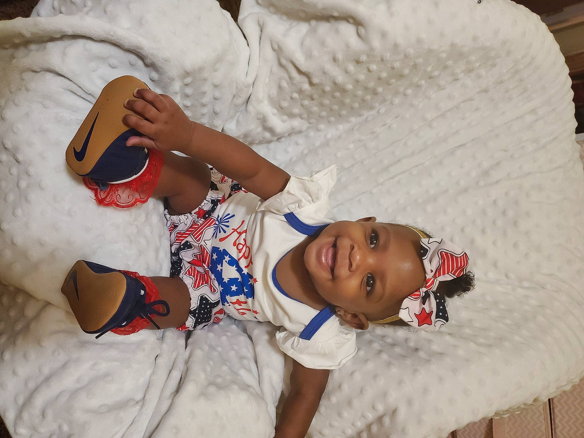 Queen is registered to the contest to win money with this photo: arm, baby_sleeping, baby_toddler_clothing, child, comfort, elbow, finger, fun, happy, hat, headgear, joint, joy, mouth, nose, person, sleeve, smile, textile, thigh