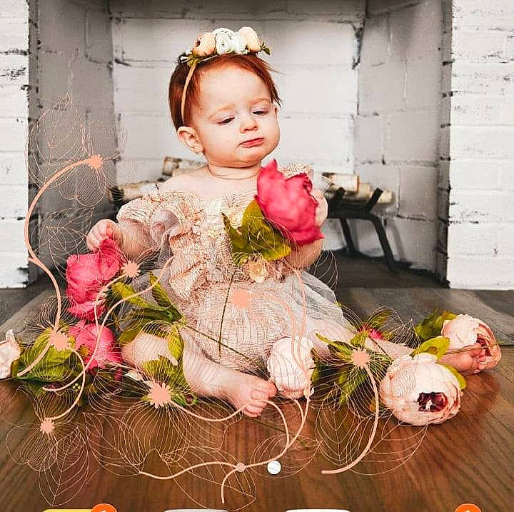 Elodie joined the competition — help win amazing prizes! baby_toddler_clothing, bouquet, child, cut_flowers, door, dress, event, fashion_design, floral_design, flower, flower_arranging, headgear, headpiece, peach, person, petal, pink, plant, textile, toddler