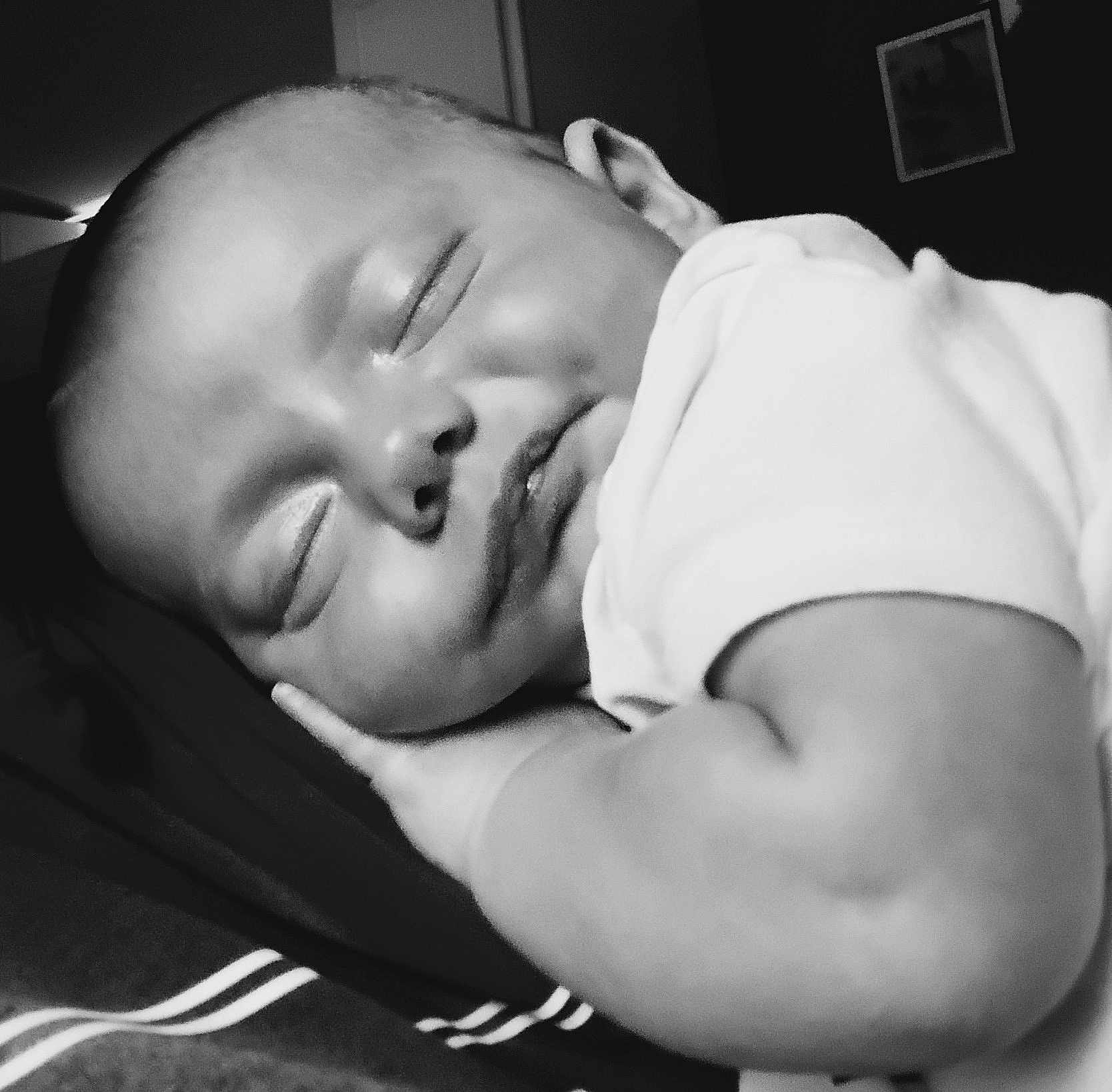 Timothy is registered to the contest to win money with this photo: baby, sleeping, black_and_white, closeup, infant, peaceful, cuddling, face, hand, soft, portrait, child, newborn, resting, monochrome, tender, calm, cute, skin, arm