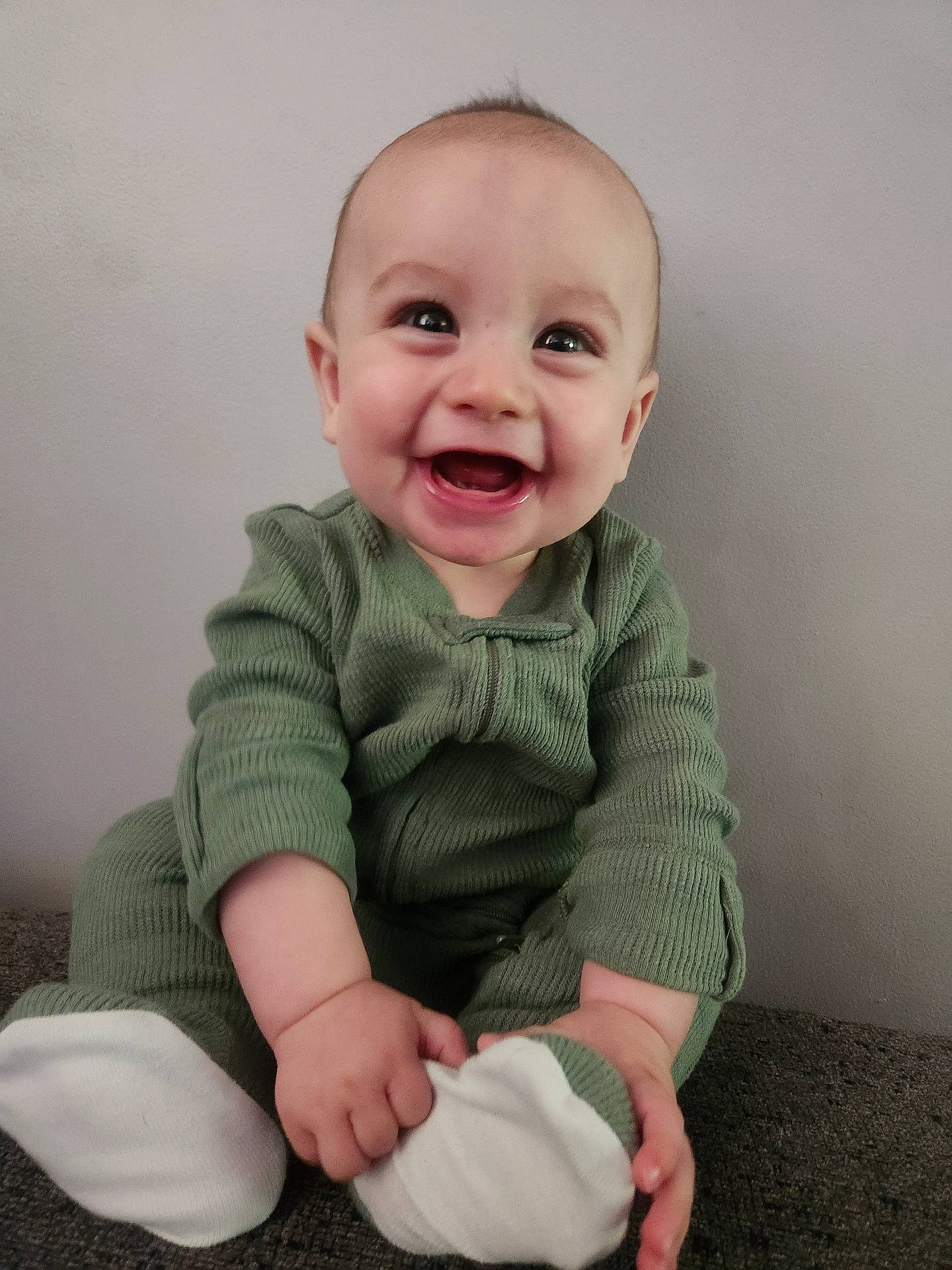 Anthony joined the competition — help win amazing prizes! baby, babylaughing, bodypart, clothing, face, finger, hand, happy, head, knitwear, laughing, longsleeve, pants, person, photography, portrait, sitting, sleeve, smile, sweater