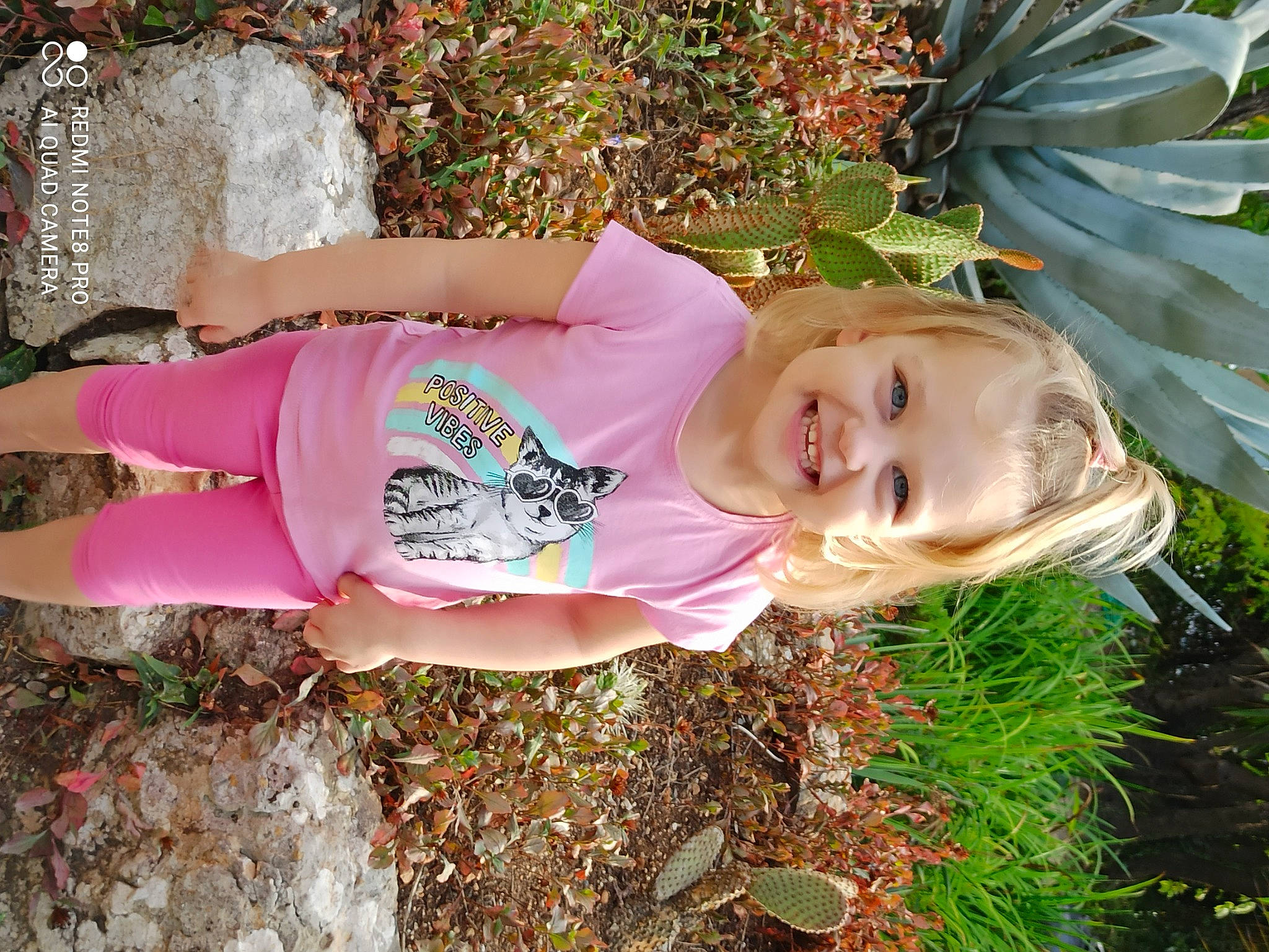 Melyna a rejoint le concours — aidez-le/la à gagner de superbes lots ! aloe, baby, baby_toddler_clothing, child, joy, people_in_nature, perennial_plant, person, pink, spring, summer, terrestrial_plant, toddler, walking_shoe, xanthorrhoeaceae