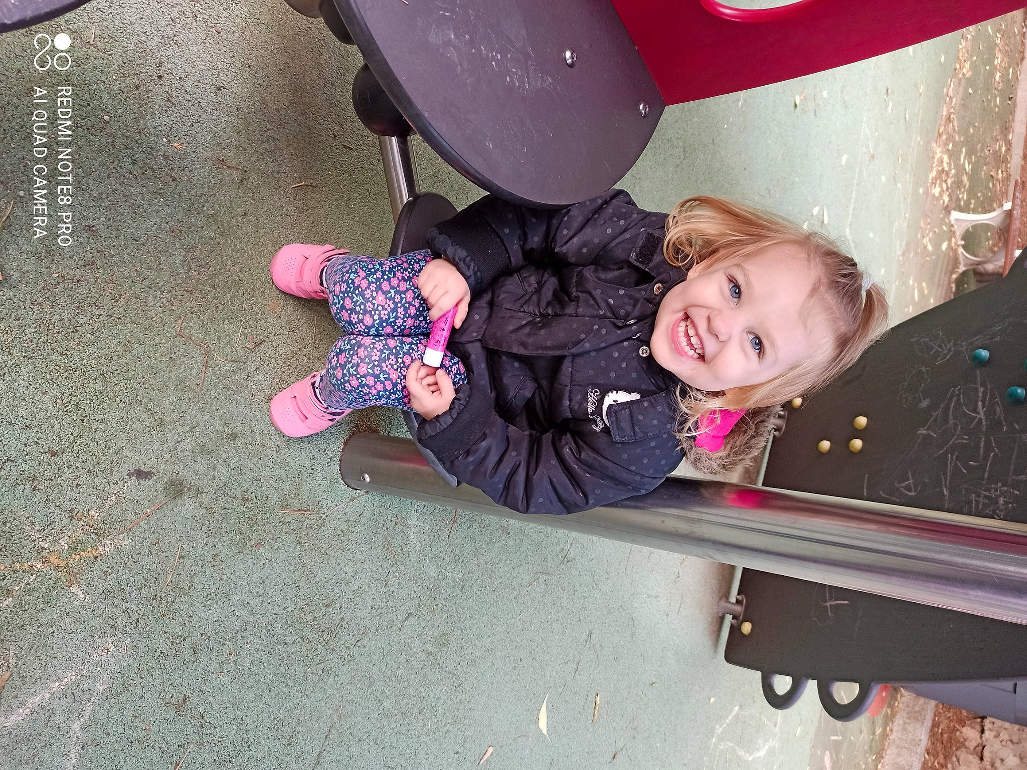 Melyna participe au concours pour gagner de l'argent avec cette photo : baby, baby_toddler_clothing, balloon, child, child_model, joy, laugh, magenta, outdoor_play_equipment, person, pink, play, playground, purple, toddler