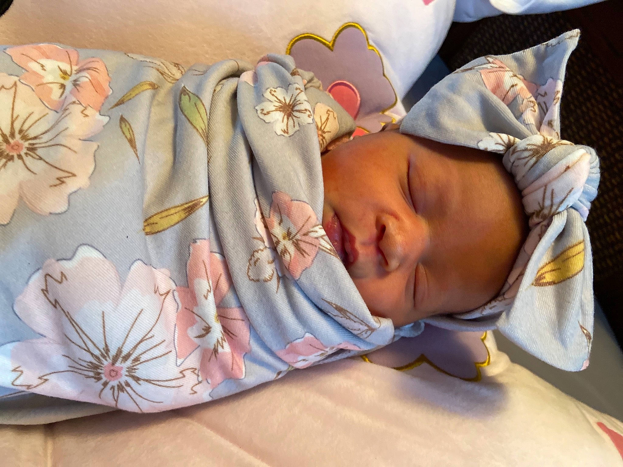 Nyema joined the competition — help win amazing prizes! baby, baby_products, baby_sleeping, baby_toddler_clothing, bedding, bedtime, child, comfort, fashion_accessory, hair_accessory, human_body, linens, nap, pattern, peach, person, petal, pink, rose, textile