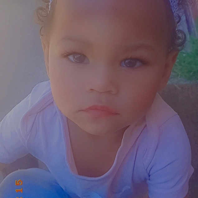 Jay'Ana is registered to the contest to win money with this photo: baby_toddler_clothing, blue, bridal_accessory, chin, cool, electric_blue, eyebrow, eyelash, flash_photography, forehead, fun, grass, happy, headband, headpiece, iris, lip, neck, skin, toddler