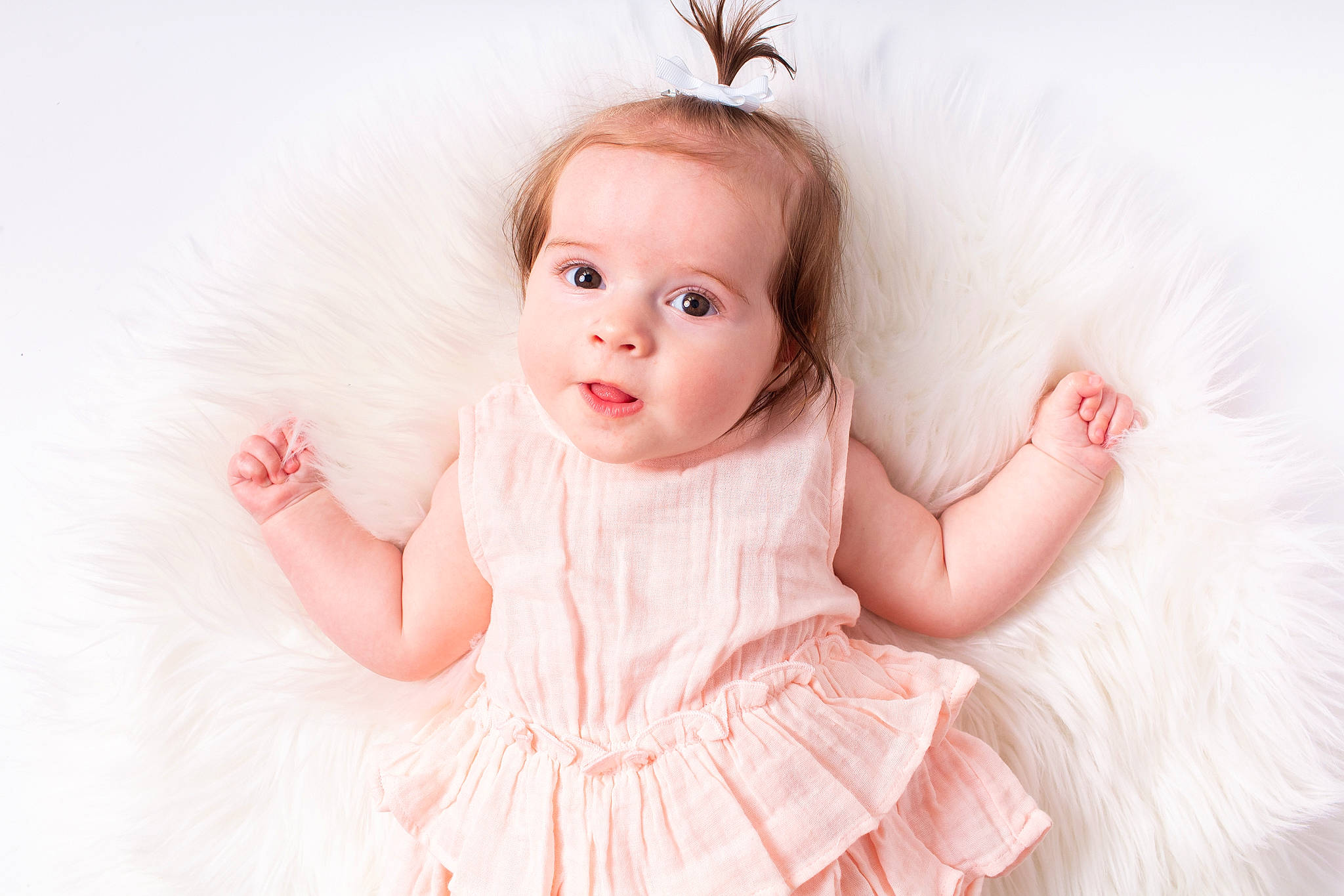 Ava joined the competition — help win amazing prizes! baby, baby_toddler_clothing, bridal_accessory, day_dress, dress, embellishment, eyelash, flash_photography, hair_accessory, happy, headgear, headpiece, iris, peach, person, pink, skin, sleeve, smile, toddler