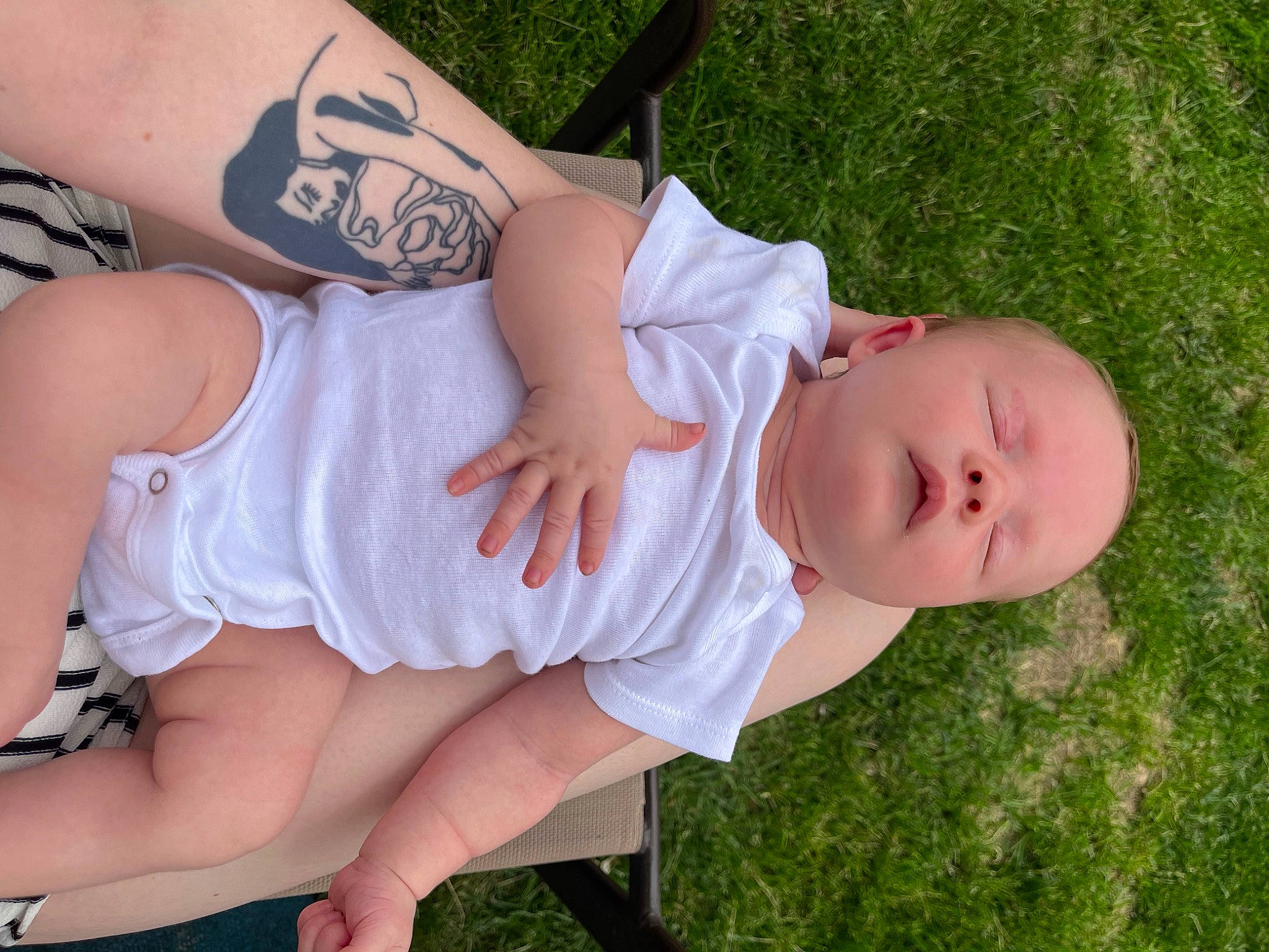 Lennon joined the competition — help win amazing prizes! arm, baby, baby_toddler_clothing, child, dress, eye, finger, foot, grass, hand, hat, human_body, human_leg, knee, leg, pattern, person, skin, sleeve, thigh