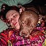 Link Hyrule joined the competition — help win amazing prizes! affection, animal, bed, brown_dog, closeup, colorful_clothing, comfort, cozy, dog, face, head, hugging, indoor, patterned_hoodie, person, pet, pillow, relaxed, snuggling, warm