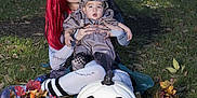 Lucian joined the competition — help win amazing prizes! woman, baby, costume, halloween, red_hair, pumpkin, autumn_leaves, outdoor, grass, face_paint, makeup, child, holiday, festive, nature, smile, seasonal, portrait, celebration, fun