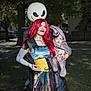 Lucian joined the competition — help win amazing prizes! adult, baby, costume, halloween, outdoor, portrait, person, red_hair, family, face_paint, makeup, jack_skelington, child, dress, patchwork, grass, tree, daylight, holding, smile