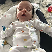 Lucian joined the competition — help win amazing prizes! baby, sleeping, onesie, animal_print, blanket, hair, indoor, carpet, toy, child, infant, peaceful, resting, cute, face, clothing, person, home, soft, cozy