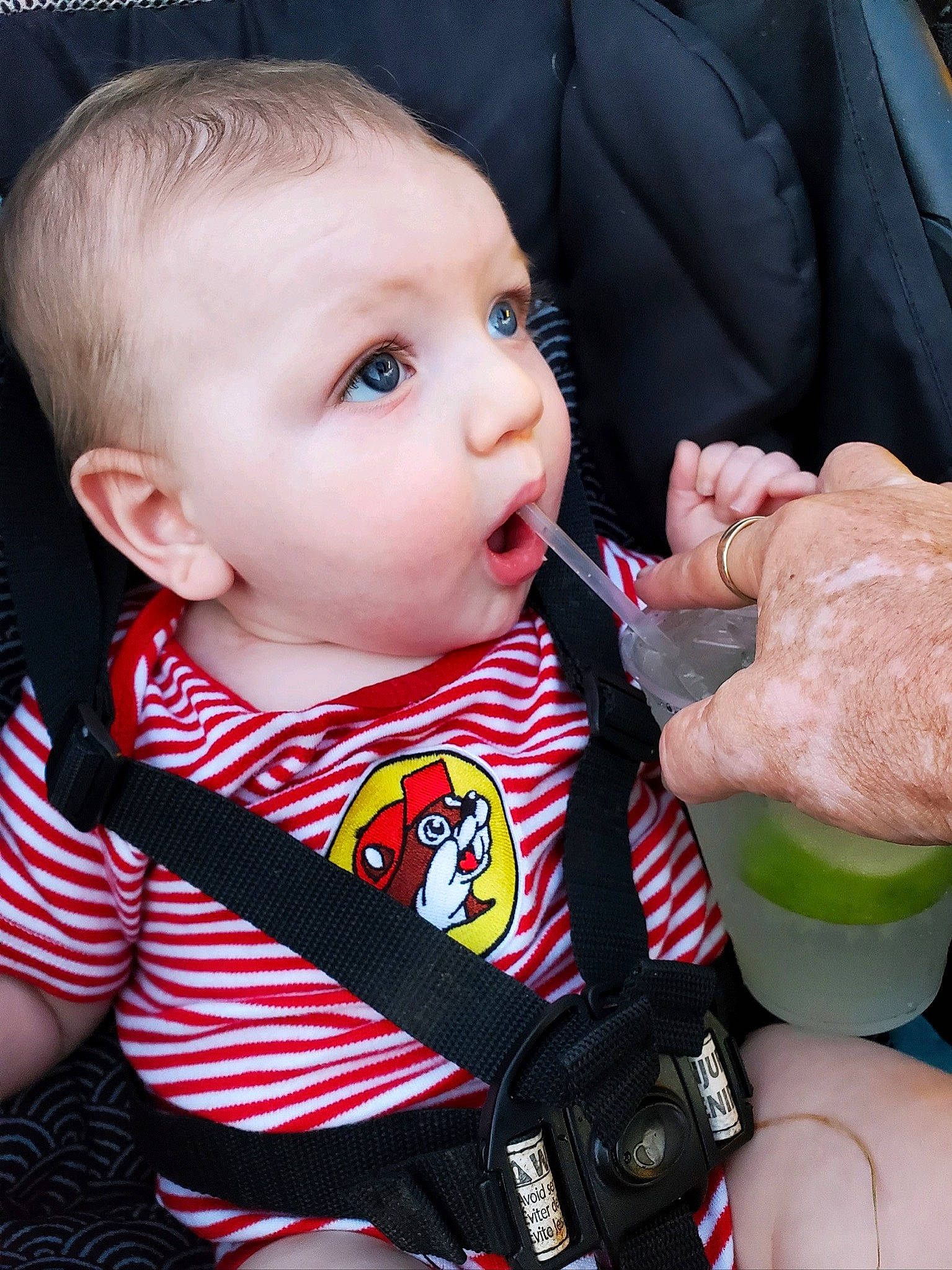 Calvin is registered to the contest to win money with this photo: baby, baby_toddler_clothing, cheek, child, chin, drinking, eyelash, finger, gesture, grass, green, iris, lip, nail, nose, person, product, skin, sleeve, surprise