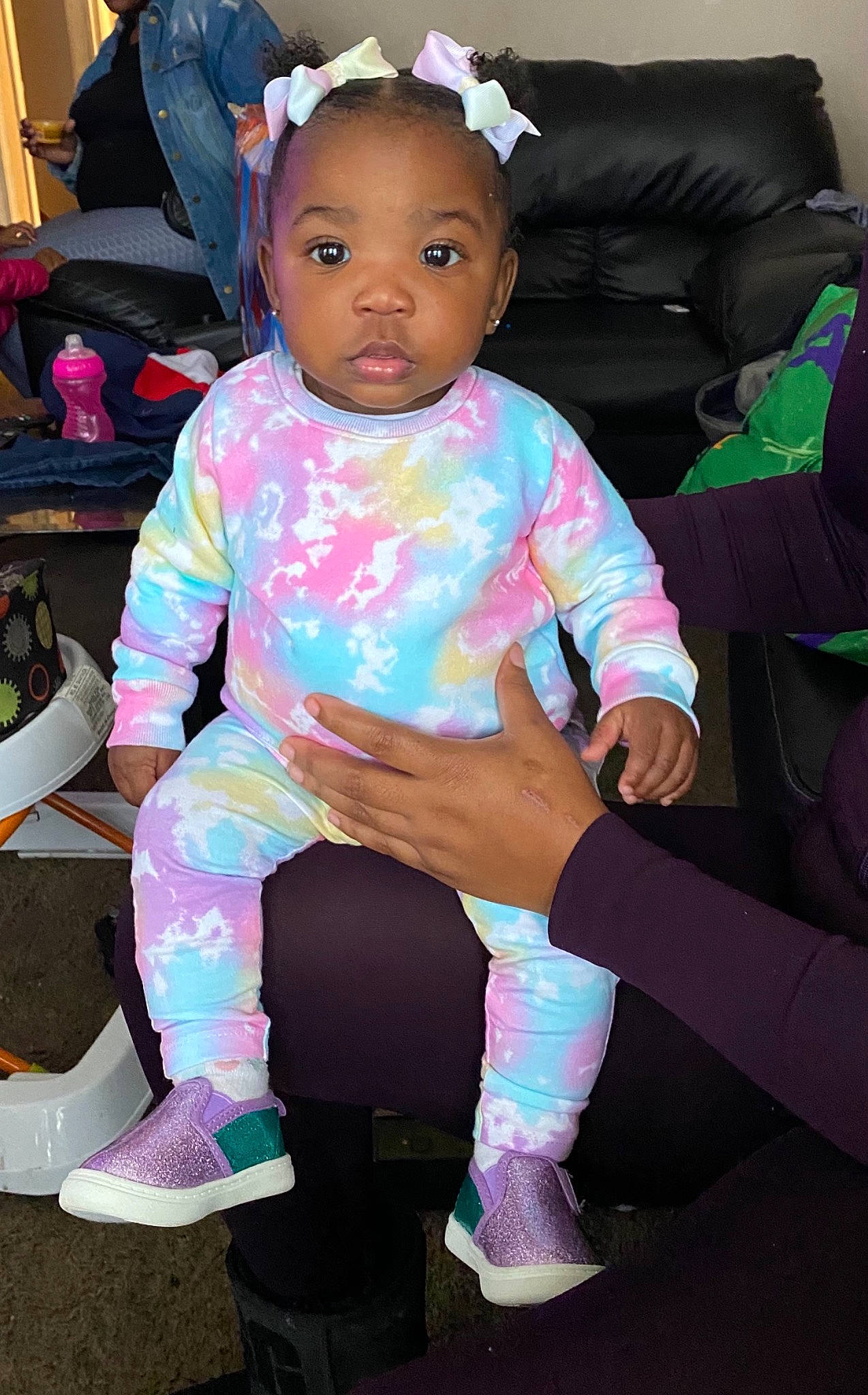 Aryn is registered to the contest to win money with this photo: ankle, baby, baby_products, baby_toddler_clothing, backpack, bag, baggage, hair_accessory, headband, headpiece, lap, person, pink, sitting, sock, toddler