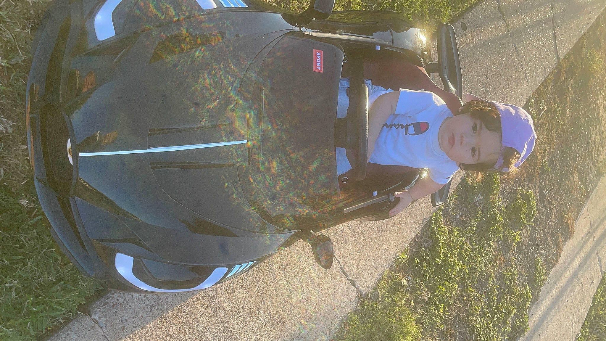 Jaivyn joined the competition — help win amazing prizes! auto_part, automotive_design, automotive_exterior, automotive_lighting, automotive_tail_brake_light, automotive_tire, automotive_wheel_system, bumper, car, fender, headlamp, hood, motor_vehicle, person, plant, tints_and_shades, tire, trunk, vehicle, vehicle_door