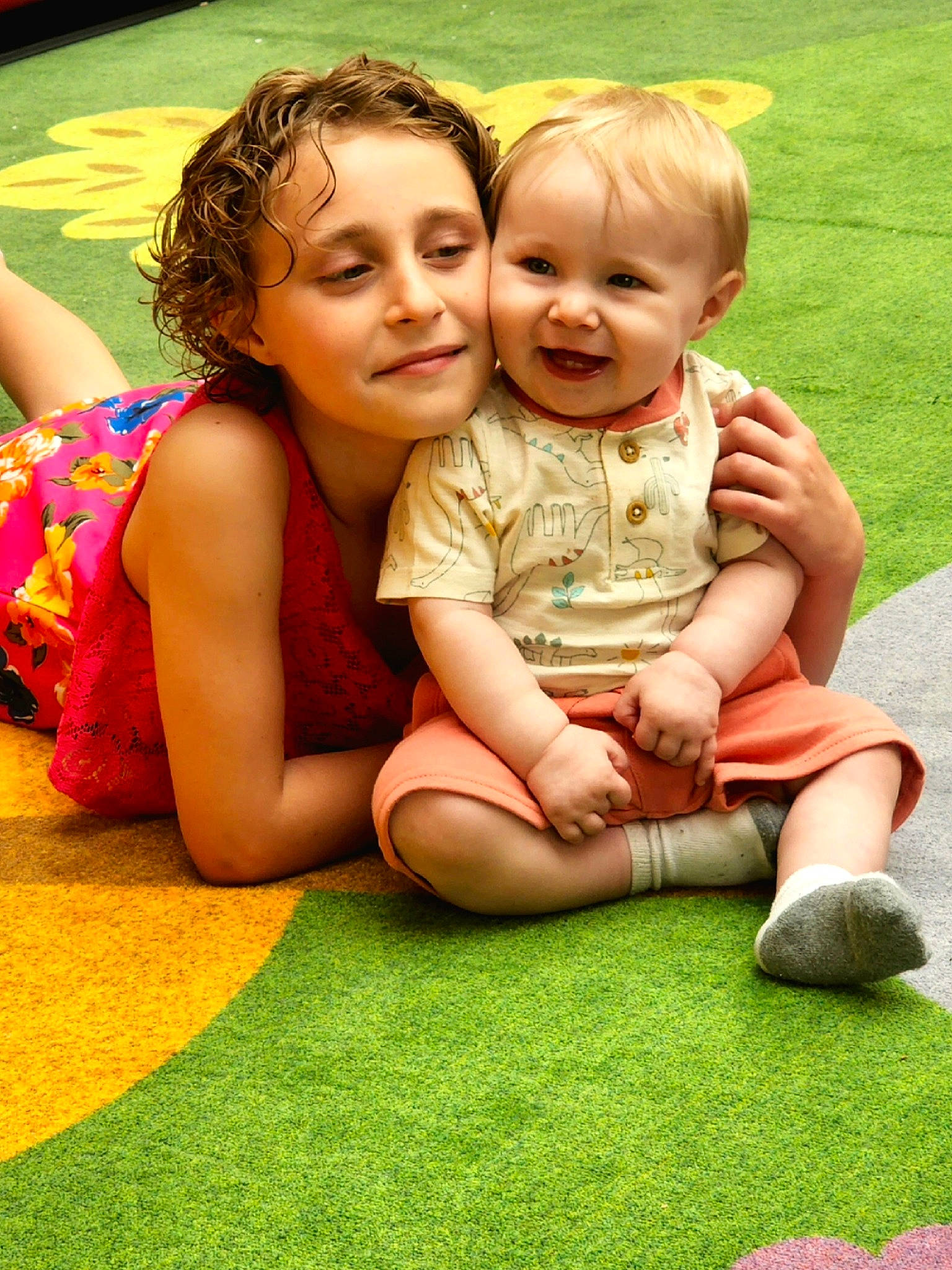 Annabelle is registered to the contest to win money with this photo: baby, botany, face, fun, gesture, grass, green, hair, hairstyle, happy, human_body, joy, leg, leisure, people, people_in_nature, person, plant, skin, smile