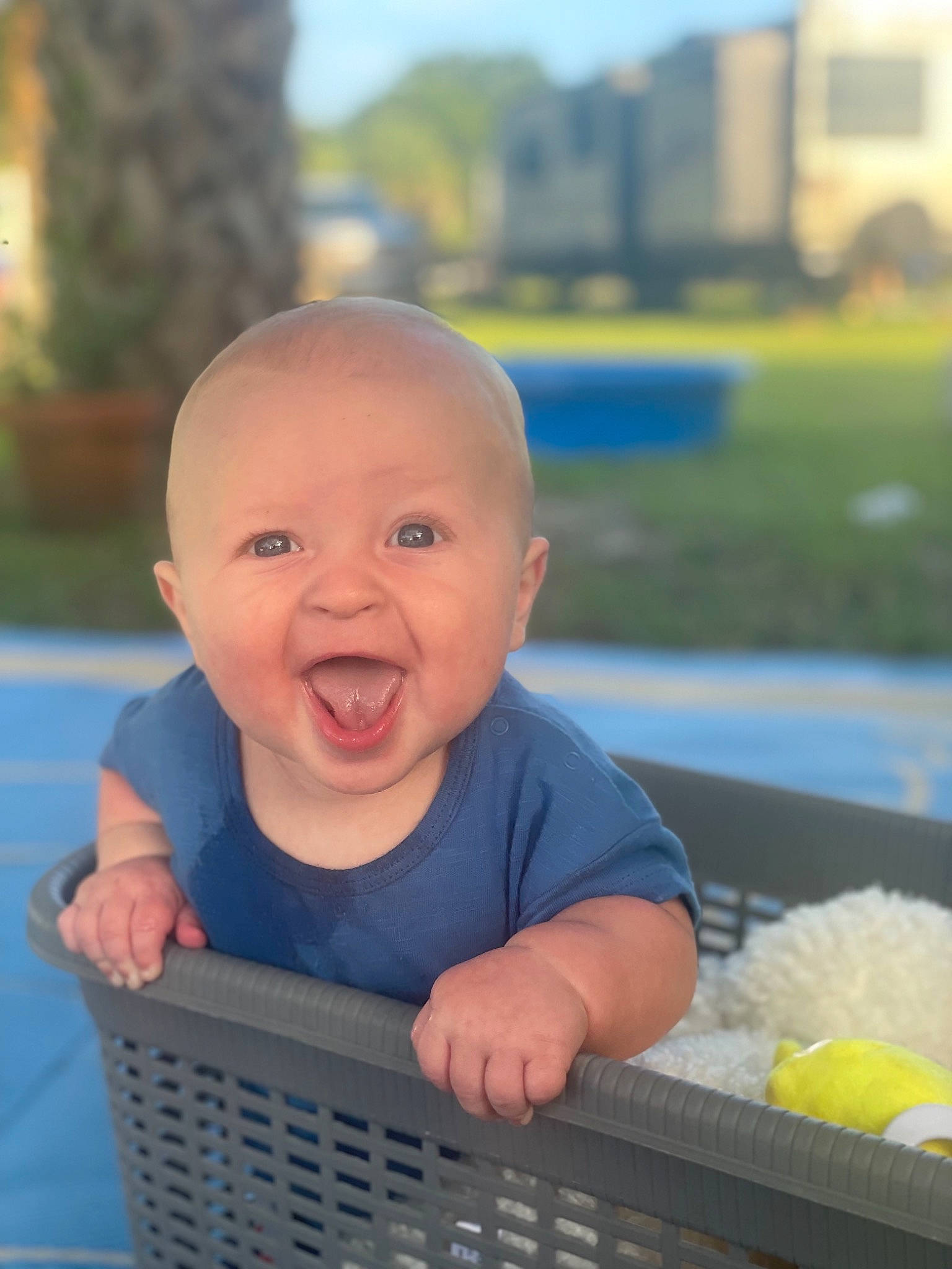Ezra joined the competition — help win amazing prizes! baby, baby_products, baby_toddler_clothing, blue, cheek, child, electric_blue, eye, fun, grass, happy, leisure, person, recreation, sitting, skin, sky, smile, thumb, toddler