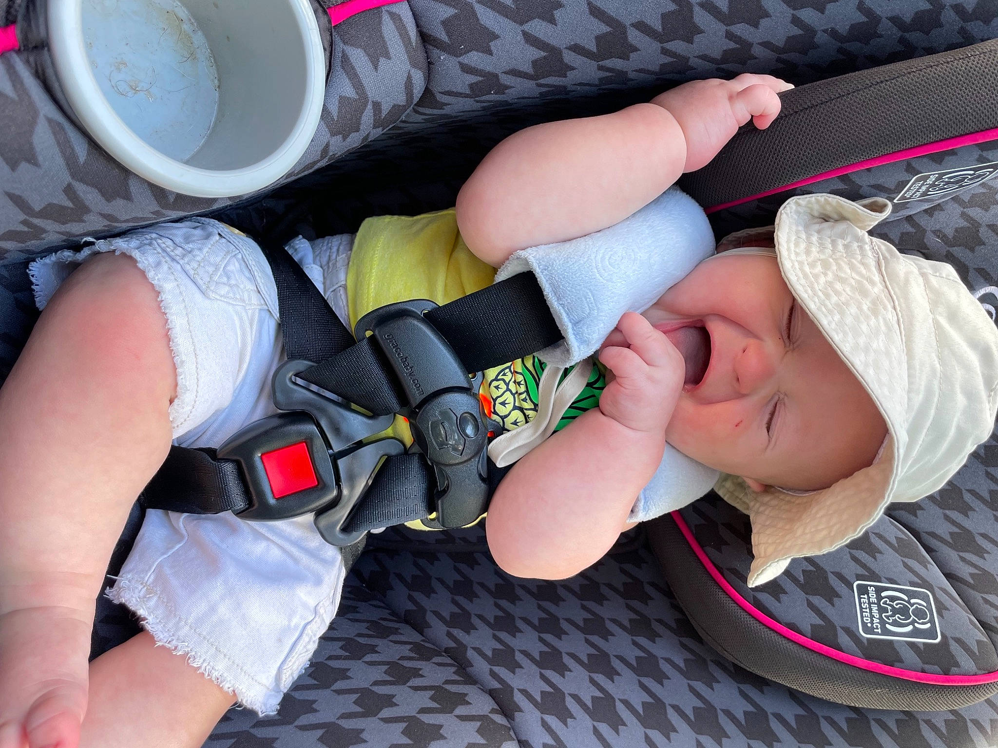 Ezra is registered to the contest to win money with this photo: arm, baby, baby_toddler_clothing, black, comfort, cool, elbow, finger, gesture, hand, headgear, headwear, joint, knee, leg, person, product, sleeve, summer, thigh