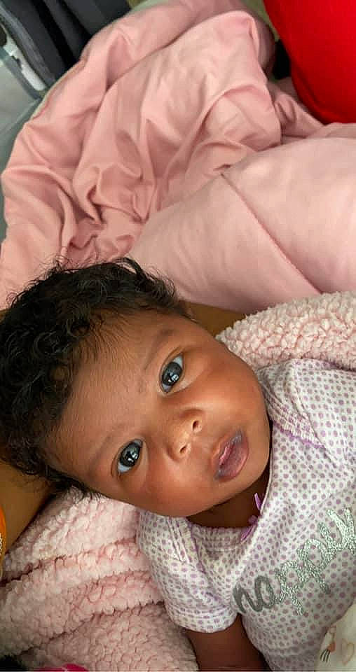 Amoura is registered to the contest to win money with this photo: baby, black_hair, cheek, child, chin, close_up, ear, eye, eyebrow, face, forehead, head, lip, mouth, nose, person, skin, smile, toddler