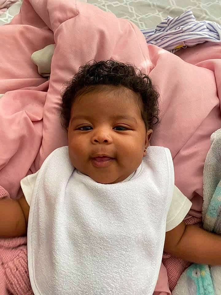 Amoura is registered to the contest to win money with this photo: baby, cheek, child, eye, face, forehead, head, lip, neck, nose, person, pink, skin, smile, toddler