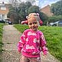 barbie, casual_wear, child, cute, daylight, fashion, grass, greenery, hair_clips, happy, outdoor, pants, person, pink_sweater, portrait, sidewalk, smile, suburban, toddler, young_child