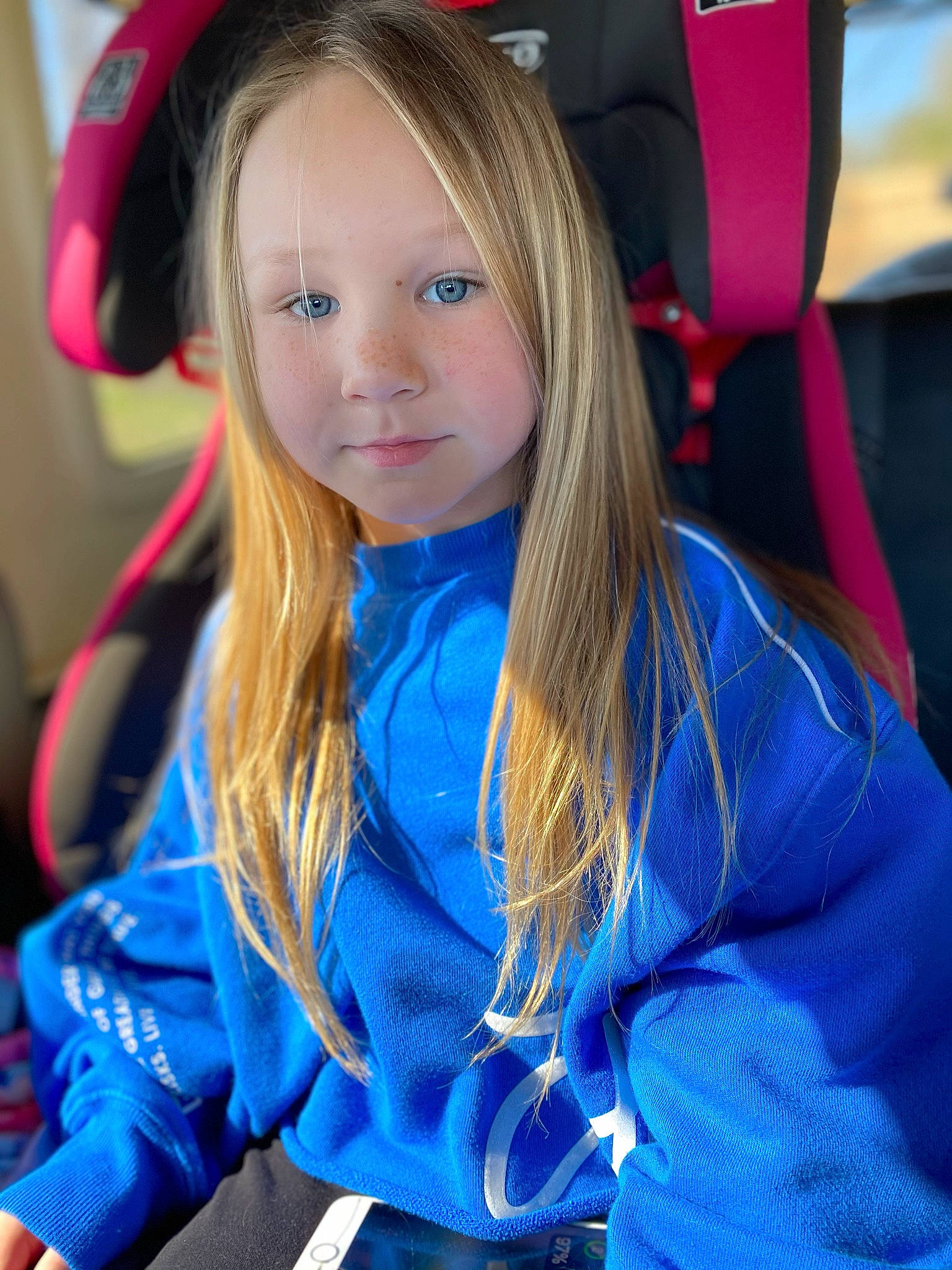 Nayely joined the competition — help win amazing prizes! automotive_design, blue, brown_hair, child, electric_blue, event, face, facial_expression, fun, hair, hairstyle, happy, long_hair, person, recreation, red, sleeve, snapshot, steering_wheel, street_fashion