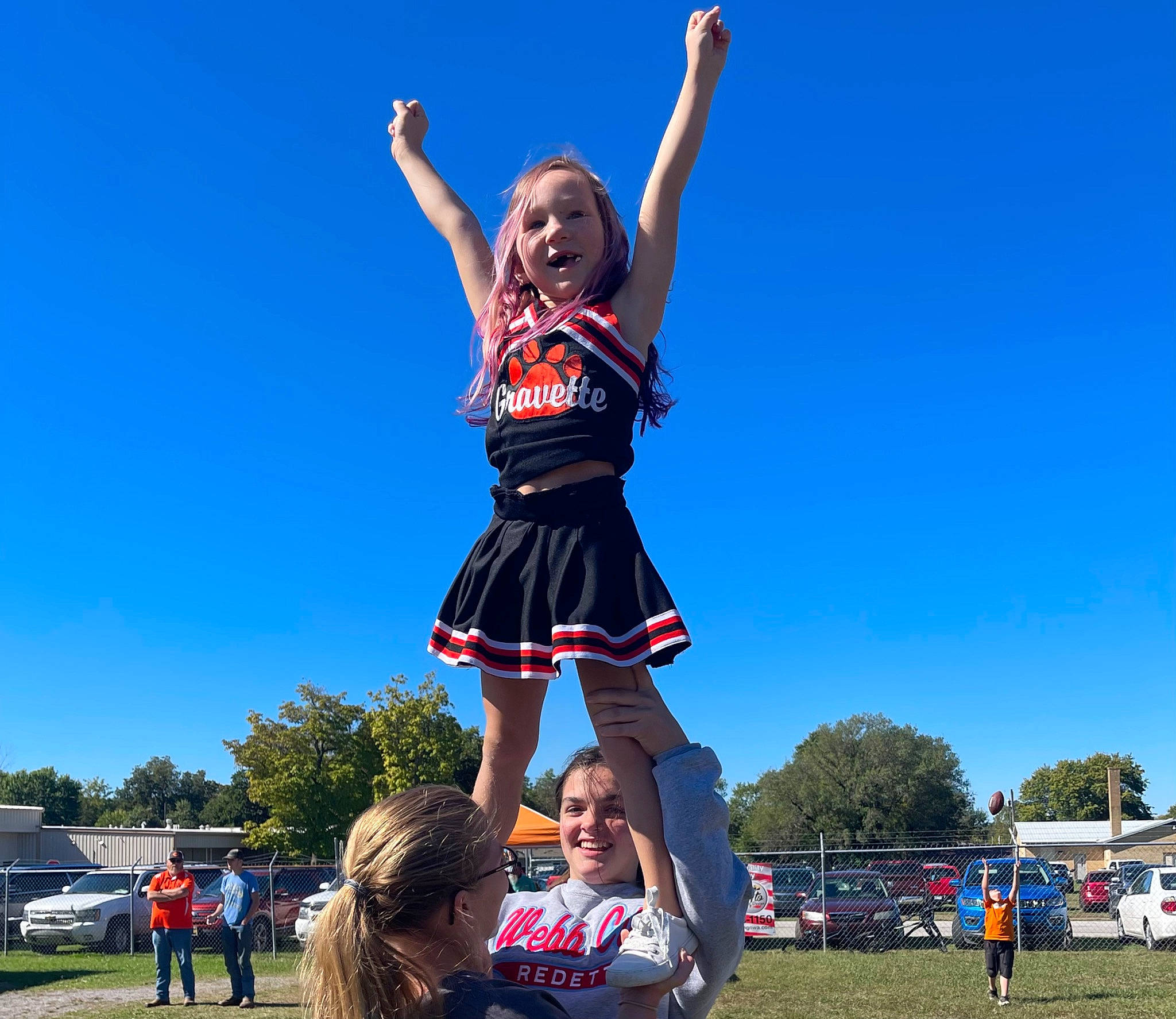 Nayely joined the competition — help win amazing prizes! cheerleading_uniform, entertainment, event, fun, grass, happy, joy, leisure, person, pole, public_event, recreation, shorts, sky, smile, sports, sports_uniform, t_shirt, thigh, travel