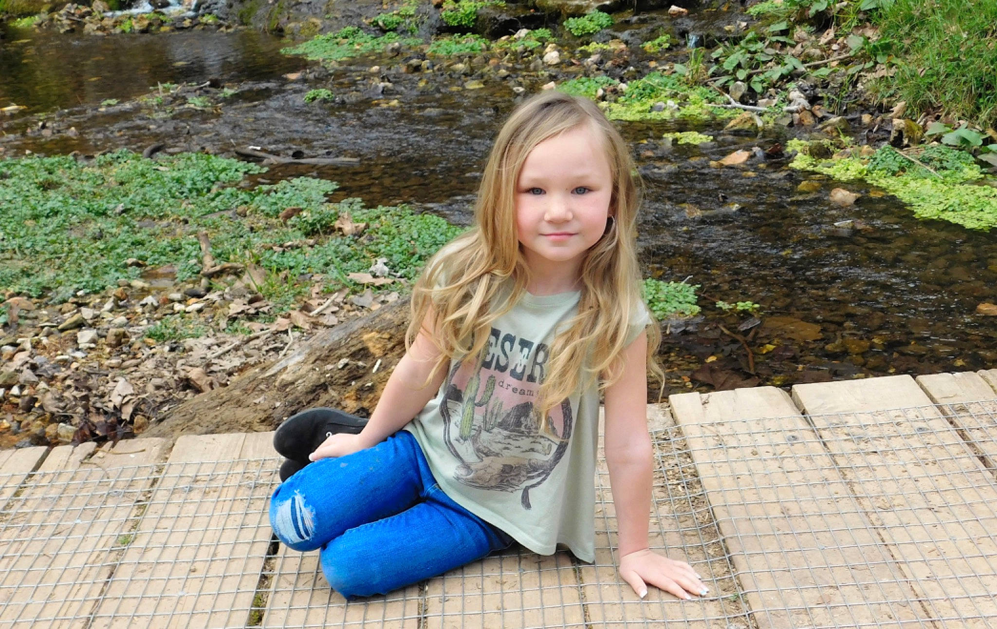 Nayely is registered to the contest to win money with this photo: eye, face, fawn, forest, grass, grass_family, groundcover, happy, head, joy, landscape, leisure, long_hair, mammal, people, people_in_nature, person, plant, sitting, smile