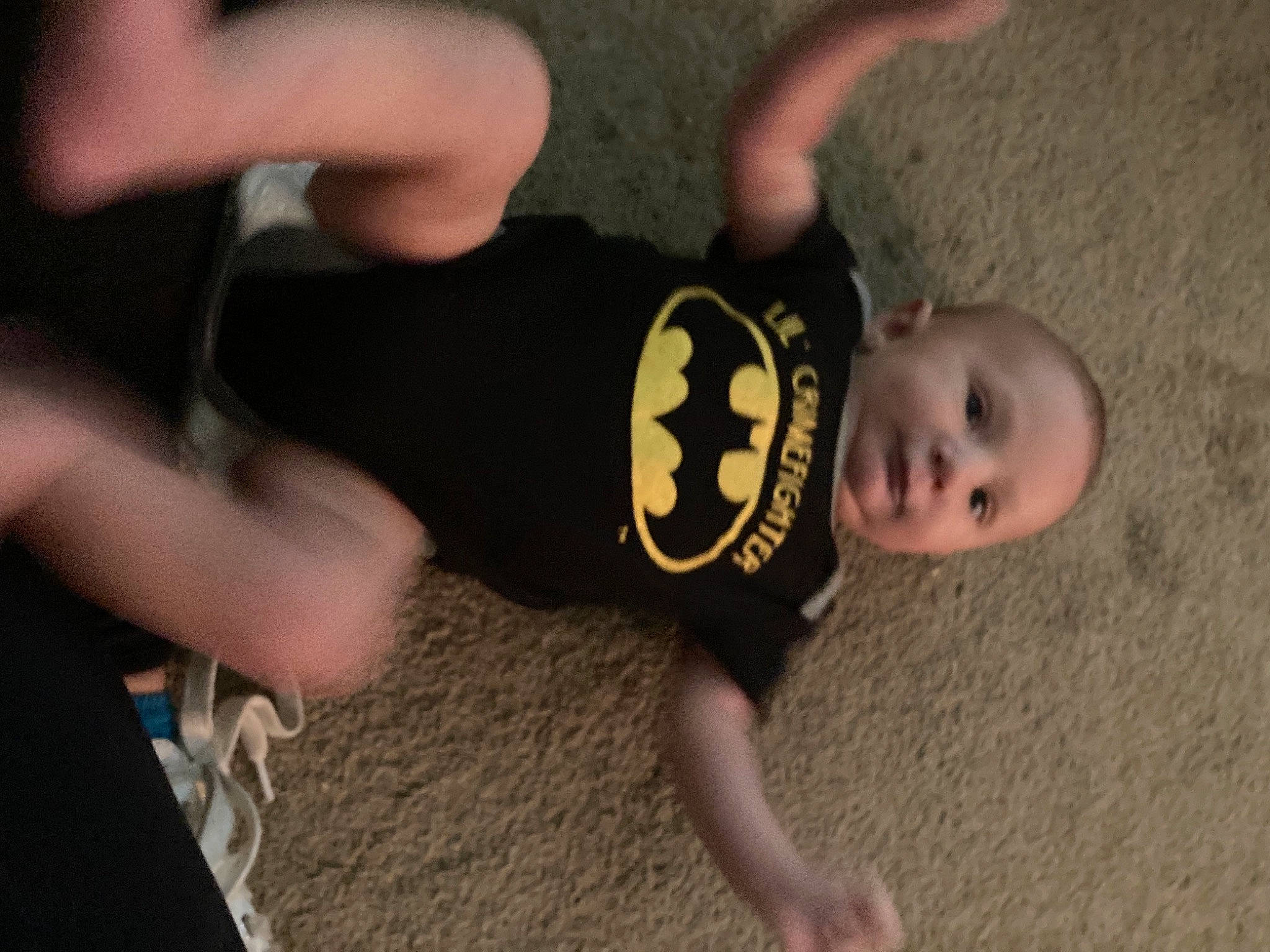 Jack is registered to the contest to win money with this photo: baby, baby_toddler_clothing, child, elbow, finger, flooring, fun, gesture, human_leg, knee, leg, person, sleeve, sportswear, t_shirt, thigh, thumb, toddler, trunk, wood