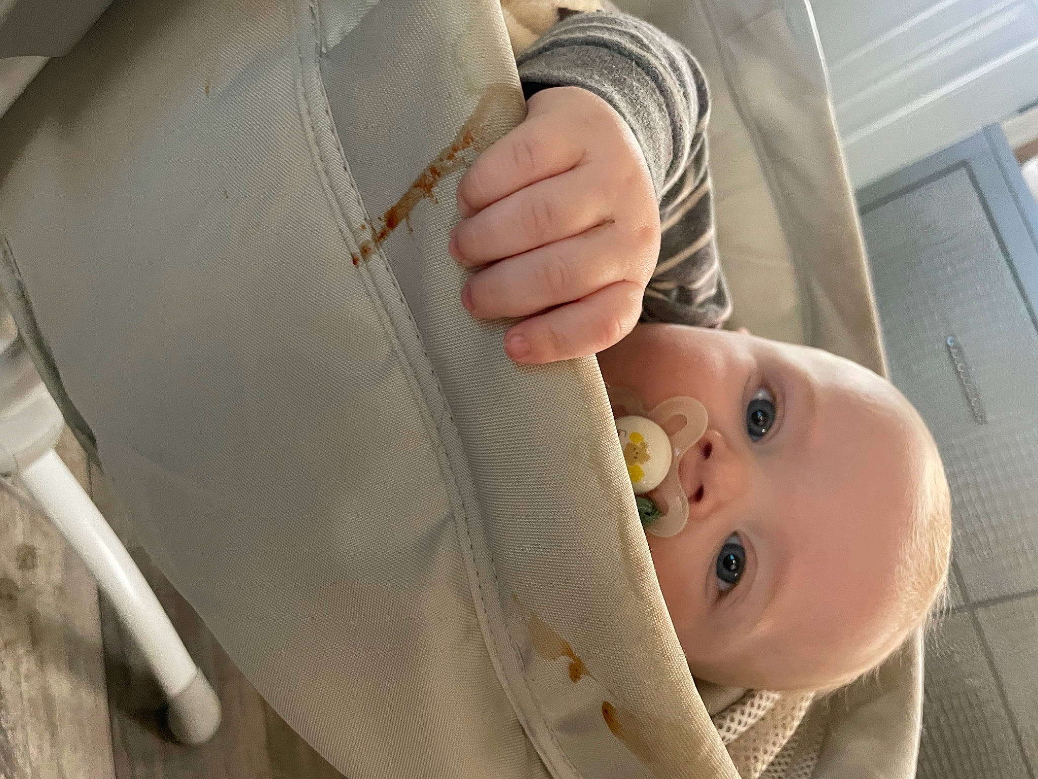 Colton is registered to the contest to win money with this photo: auto_part, baby, baby_carriage, baby_products, baby_safety, baby_toddler_clothing, beige, car_seat, child, comfort, fashion_accessory, gesture, person, seat_belt, sleeve, thumb, toddler, window