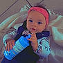 Shanna participe au concours pour gagner de l'argent avec cette photo : accessories, baby, bodypart, bonnet, bottle, cap, clothing, couch, face, finger, furniture, glove, hand, hat, head, lotion, person, photography, portrait, waterbottle