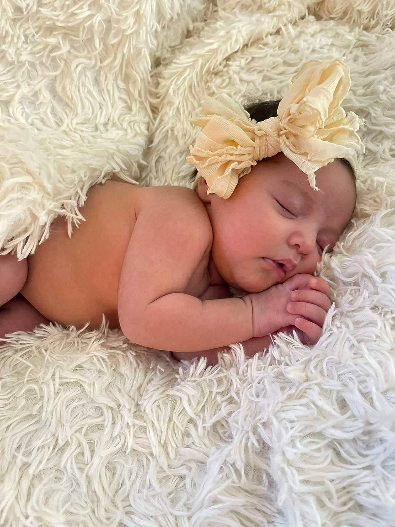 Coraline joined the competition — help win amazing prizes! baby, baby_sleeping, baby_toddler_clothing, child, comfort, crochet, fashion_accessory, grass, hair_accessory, hand, happy, headband, headgear, headpiece, headwear, jewellery, linens, pattern, person, petal