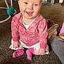 Rosey joined the competition — help win amazing prizes! baby, child, smiling, pink_hoodie, socks, carpet, indoor, toy, person, happy, cute, crawling, floor, casual_clothing, home, sitting, infant, blue_eyes, playtime, young_child