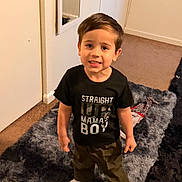 Shane joined the competition — help win amazing prizes! child, boy, smile, indoor, carpet, rug, clothing, tshirt, pants, white_socks, standing, room, mirror, door, wall, floor, hair, person, happy, portrait