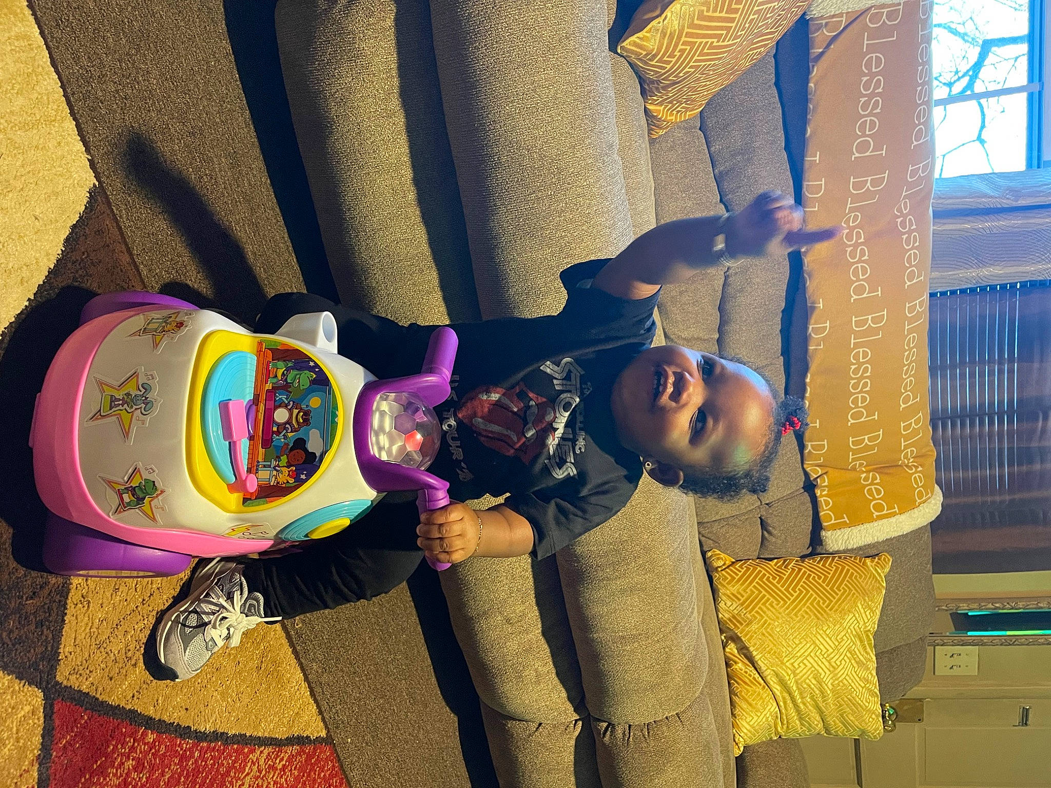 Legacy is registered to the contest to win money with this photo: bag, car_seat, child, comfort, cool, electric_blue, eyewear, fashion_accessory, fun, hat, headgear, helmet, human, leisure, mammal, person, purple, room, textile, vertebrate