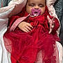 Aliyah a rejoint le concours — aidez-le/la à gagner de superbes lots ! baby, infant, pacifier, red_dress, blanket, cozy, child, cute, hand, clothing, portrait, indoors, warm, soft, smiling, toddler, wrapped, nap, resting, car_seat