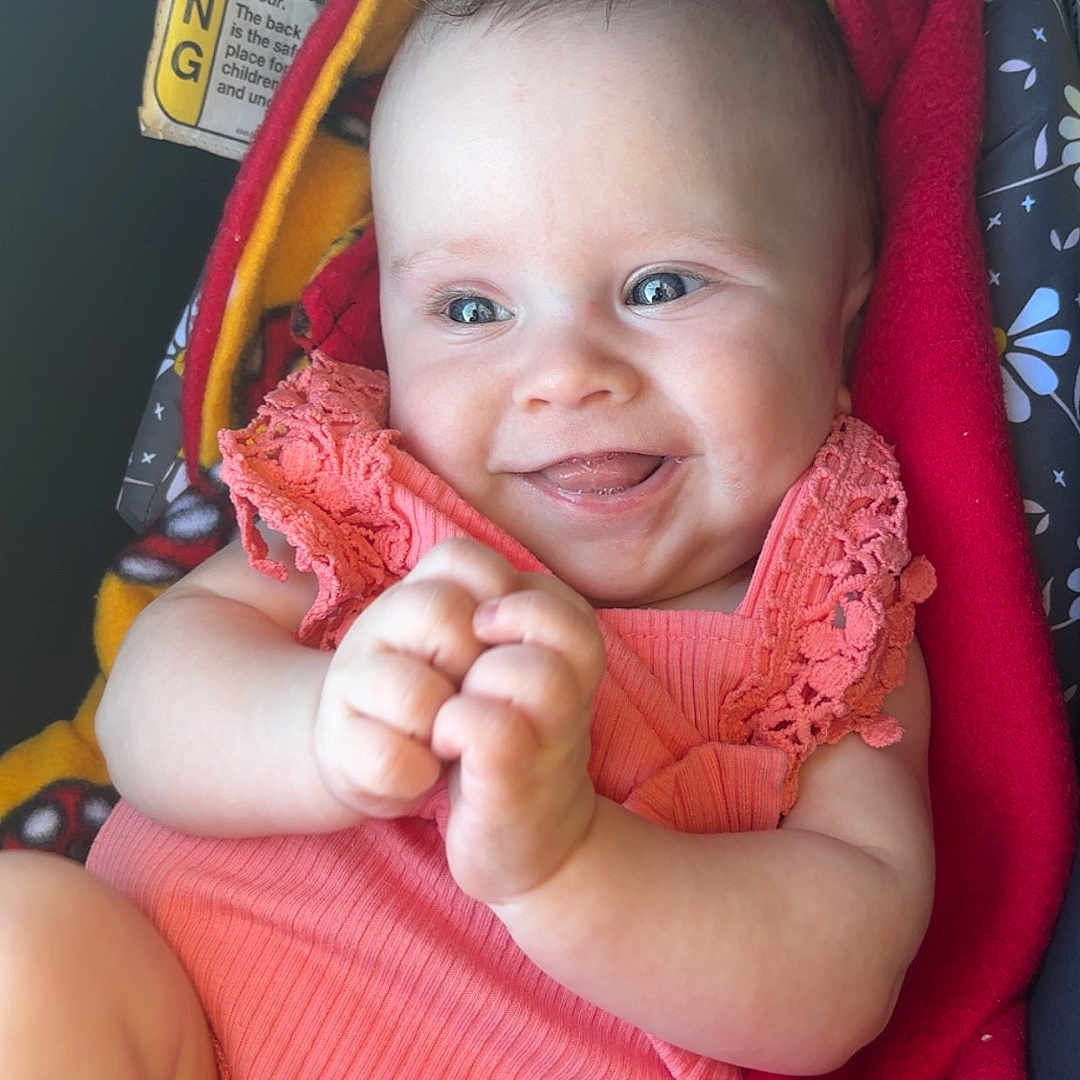 Brexleigh is registered to the contest to win money with this photo: baby, blanket, bright, car_seat, child, clothing, cute, expression, face, hands, happy, head, indoors, infant, person, seat, sitting, skin, smiling, tongue