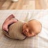 Blaze joined the competition — help win amazing prizes! newborn, baby, sleeping, infant, wrapped, blanket, plaid, bed, cozy, soft, portrait, indoors, peaceful, cute, skin, head, feet, tiny, warm, relaxing