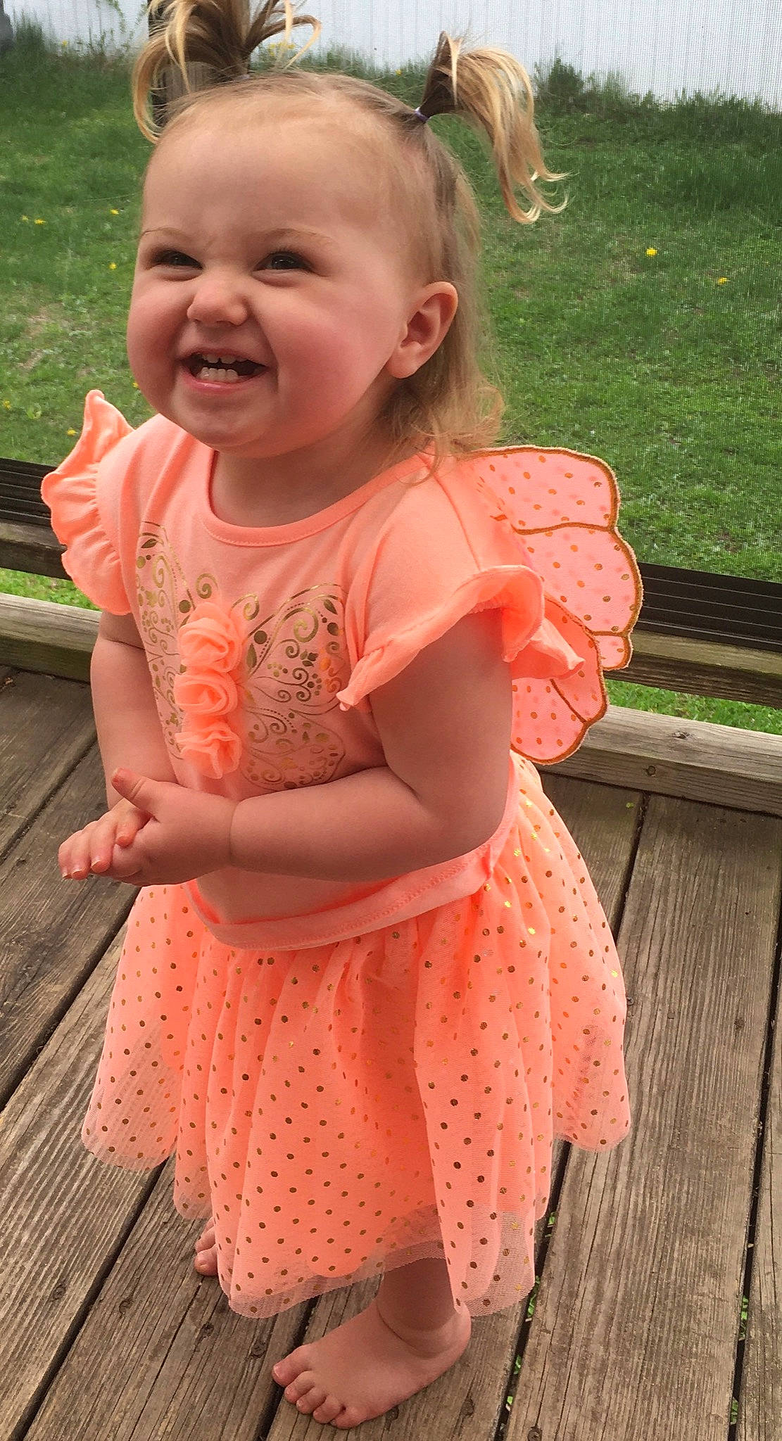 Hazel joined the competition — help win amazing prizes! child, design, dress, facial_expression, finger, joy, pattern, peach, person, pink, sleeve, smile, toddler