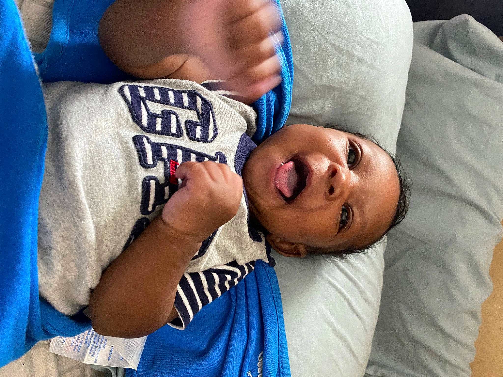 Kyree is registered to the contest to win money with this photo: arm, blue, clothing, comfort, elbow, eye, eyelash, finger, gesture, happy, joint, knee, mouth, muscle, neck, people, person, shoulder, sleeve, t_shirt