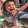 arms_up, baby, child, clothing, colorful, cute, expression, face, happy, hat, infant, jingle_bells, joyful, outdoor, playmat, sitting, smiling, sunhat, sunlight, toy