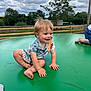 barefoot, candid, casual_clothing, child, clouds, cute, daylight, fence, grass, green, happy, nature, outdoor, playtime, sky, smiling, summer, toddler, trampoline, trees