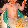toddler, baby, high_chair, food, messy, smiling, face, plate, indoor, child, happy, diaper, feeding, orange_food, cute, funny, mess, person, sitting, portrait