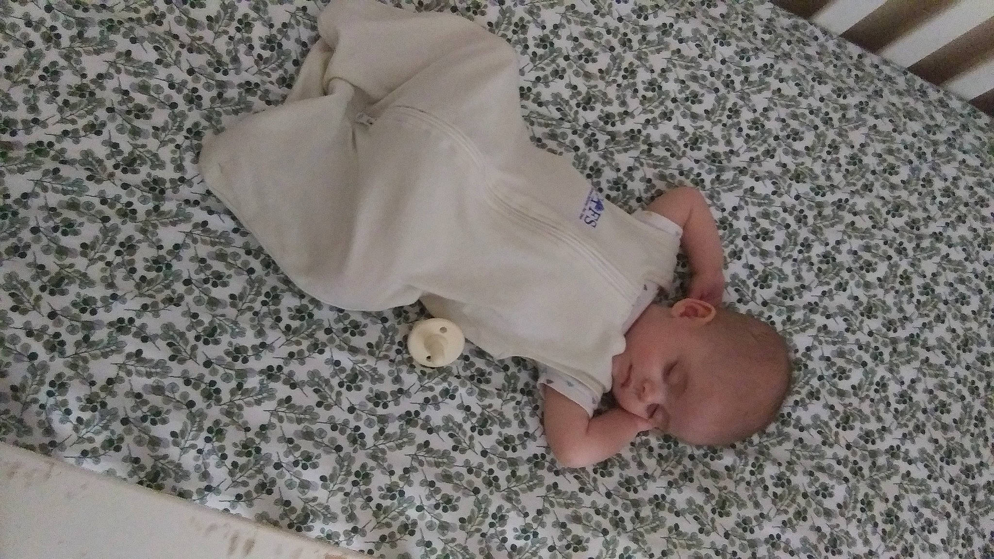 Thea is registered to the contest to win money with this photo: baby, baby_toddler_clothing, barefoot, bedding, bedtime, child, comfort, flooring, foot, linens, nap, pattern, person, room, sleep, textile, toddler, wood