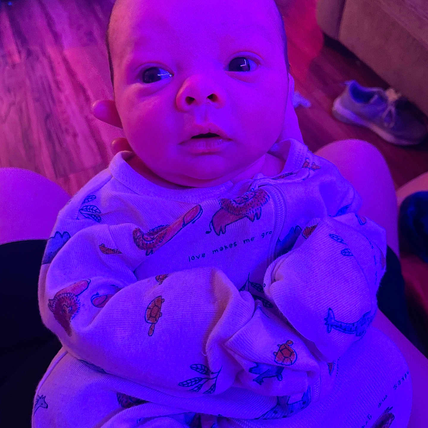 Evante is registered to the contest to win money with this photo: architecture, baby, blanket, bodypart, building, clothing, couch, face, finger, footwear, furniture, hand, head, indoors, newborn, person, photography, portrait, purple, shoe