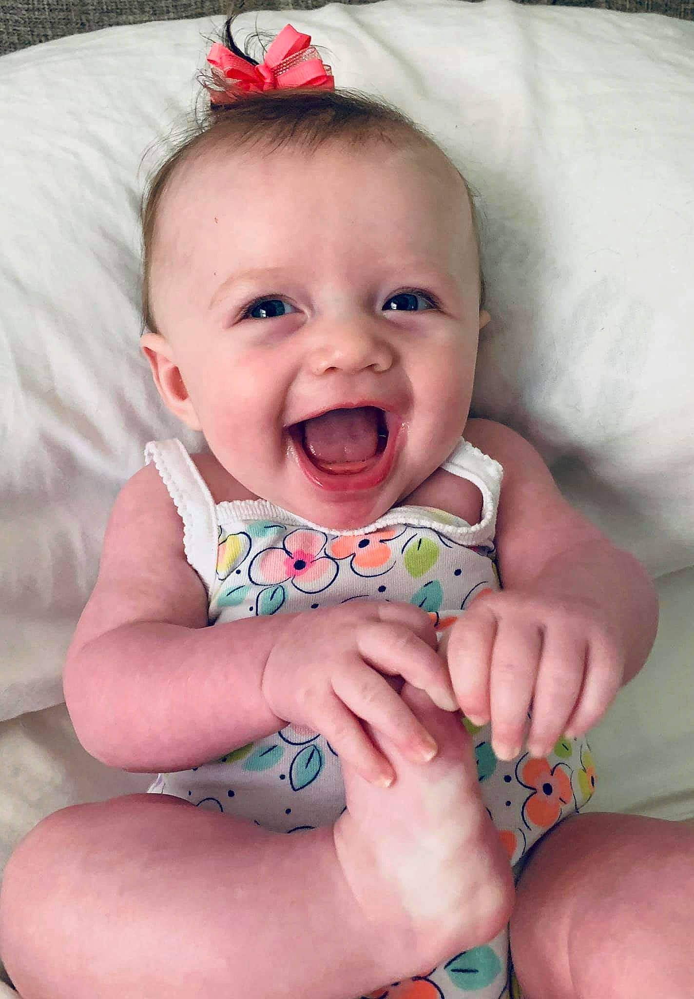 Daniella is registered to the contest to win money with this photo: baby, baby_laughing, baby_making_funny_faces, baby_products, baby_toddler_clothing, cheek, child, face, facial_expression, finger, hand, leg, lip, mouth, nail, person, skin, smile, toddler