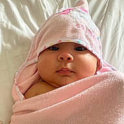 Zoé Valentina is registered to the contest to win money with this photo: baby, bed, blanket, cheeks, child, cute, expression, face, hooded_towel, indoors, infant, lying_down, newborn, pink_towel, portrait, resting, skin, soft, warm, wrapped